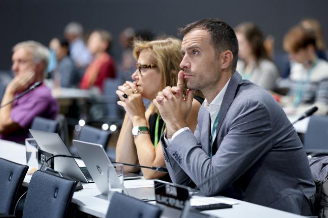 Delegates listening to the process 