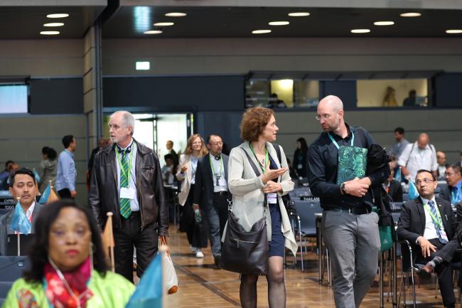 Delegates walking into the plenary for the afternoon session 