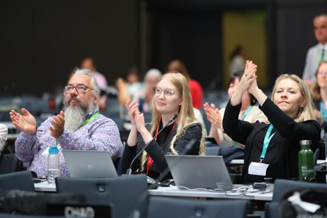 Delegates celebrating the approval of the SPM  