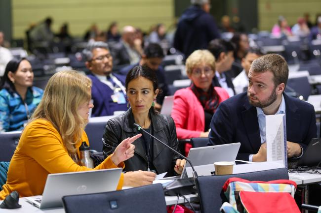 Delegates from the EU conferring during a break in negotiations