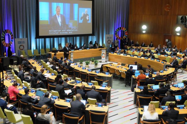 Delegates listen to the intervention by Klaus Iohannis, President of Romania