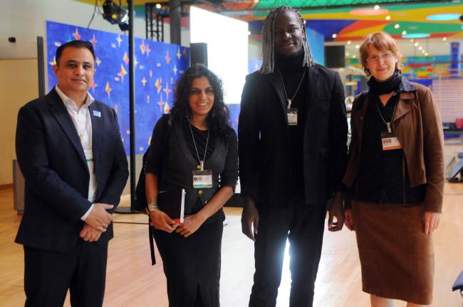 Group photo of panel speakers at the end of the opening session