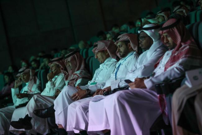 Delegates listen to the discussions during the different tracks