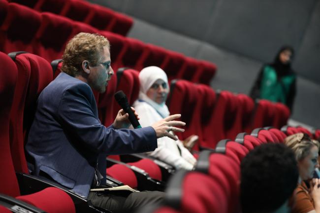 Participants ask questions during the session