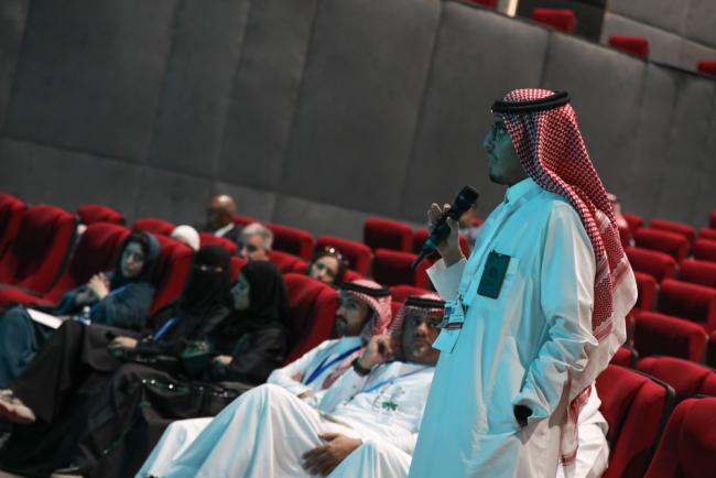 Participants ask questions during the session