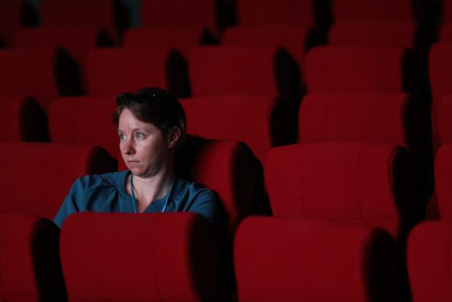 A participant listens to the discussions