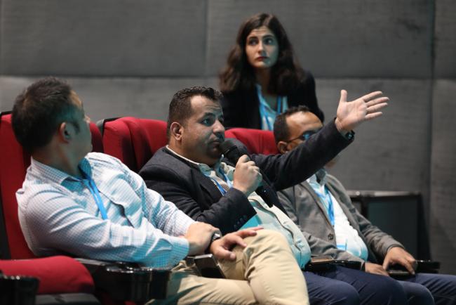 Participants ask questions from the floor