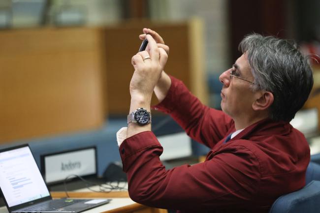 A delegate taking a photo 