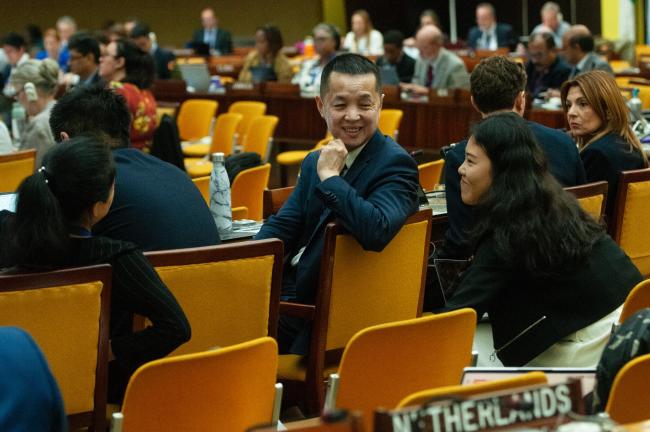 Chinese delegates confer during the Working Group