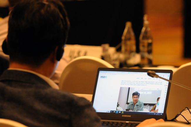 A delegate checks ENB website