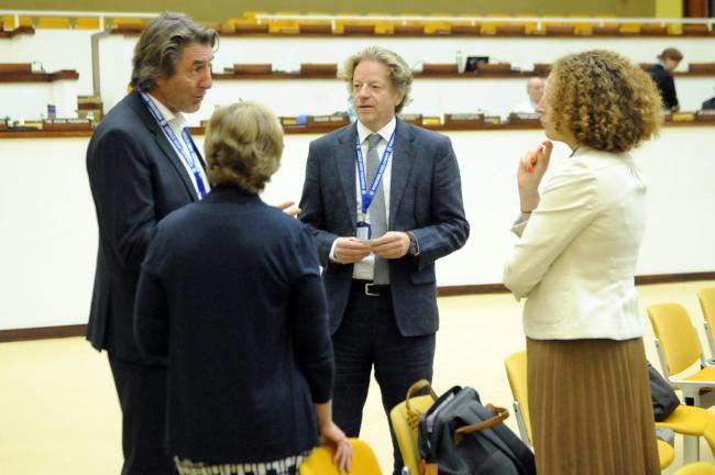 Delegates confer