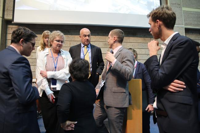 Delegates consulting informally with Stadler Trengove, UNEP Legal Advisor, and members of INC Secretariat  