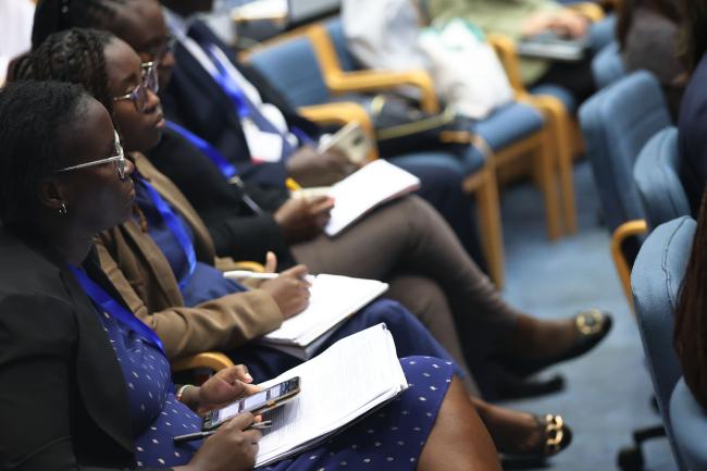 Delegates taking notes 
