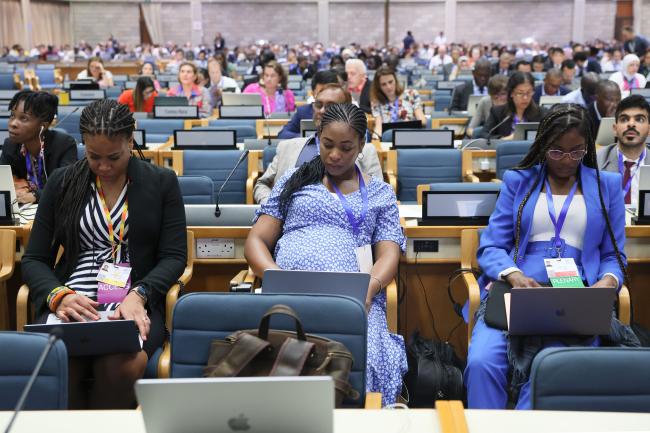 Delegates taking notes