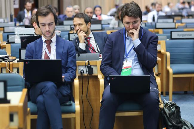 Delegates taking notes
