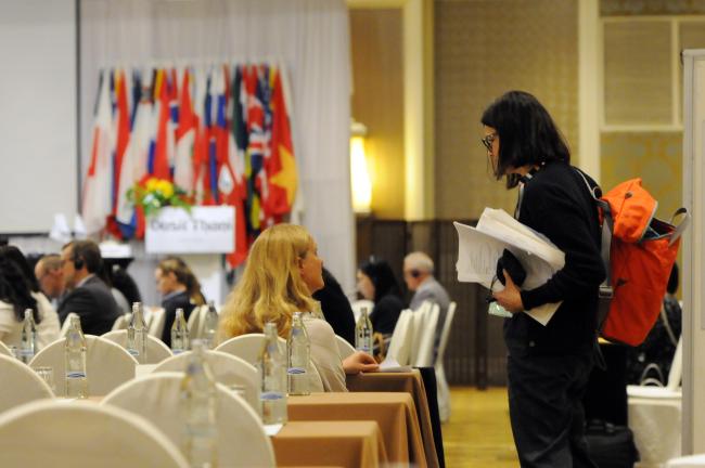 Emma Rivière and Carmen Soliño, meeting interpreters, confer during the session.