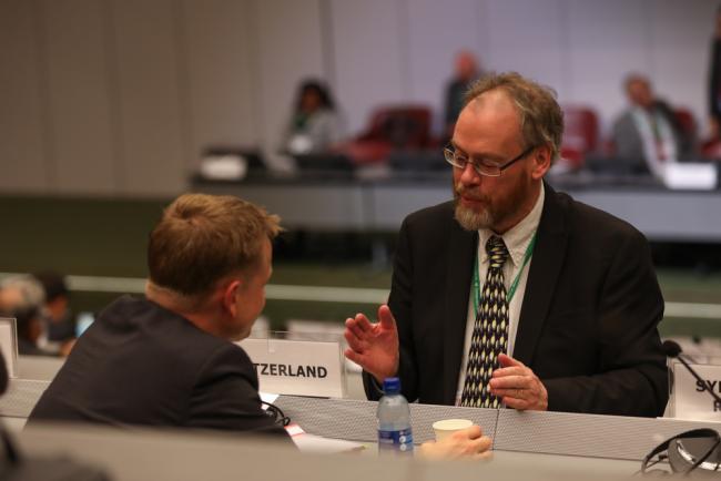 Delegates speak informally
