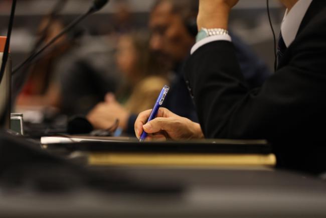 Delegate takes notes