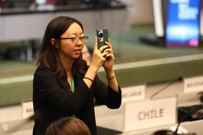 Delegate takes photos