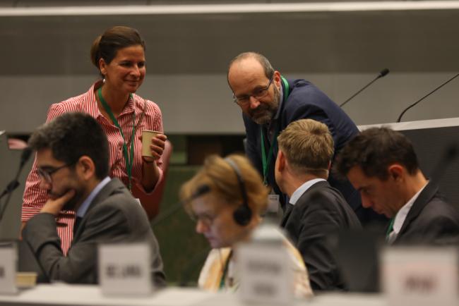 Delegates speak informally