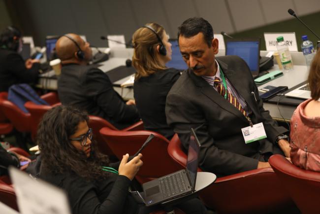 Delegates from India consult