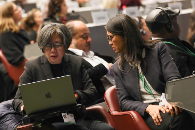 Delegates from Cambodia consult