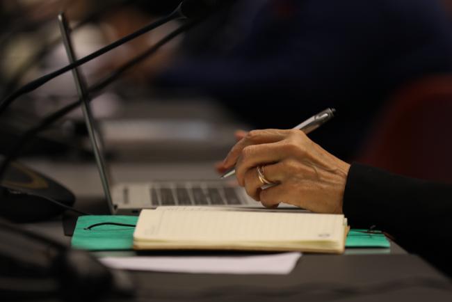 Delegate takes notes