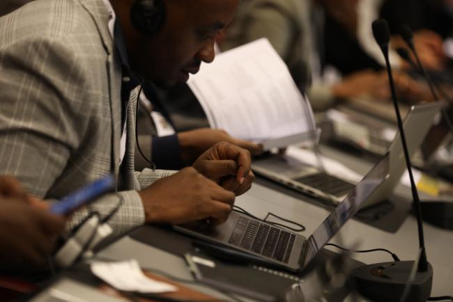 Delegates take notes