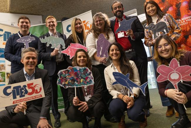 Members of the Environmental Investigation Agency (EIA) celebrate the closure of SC 77