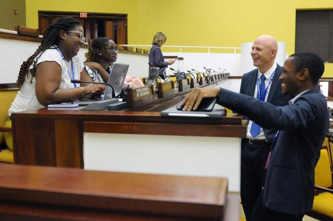 Representatives from Observer organizations share a laugh before the morning session