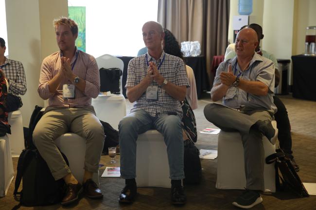 Participants applauding the presentations 
