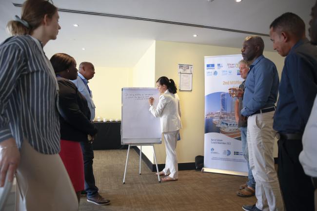 Participants working in groups during the Fostering a Sustainable Blue Economy workshop 