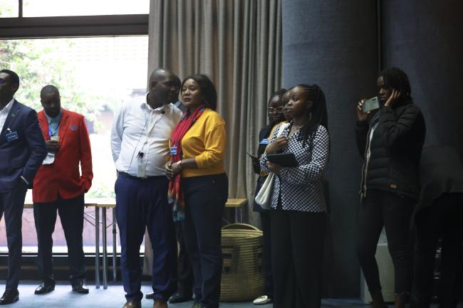 Visitors explore the room of Contact Group 2 during a guided UN tour