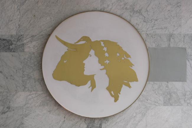 artwork at the venue depicting a bull and a woman looking into the distance