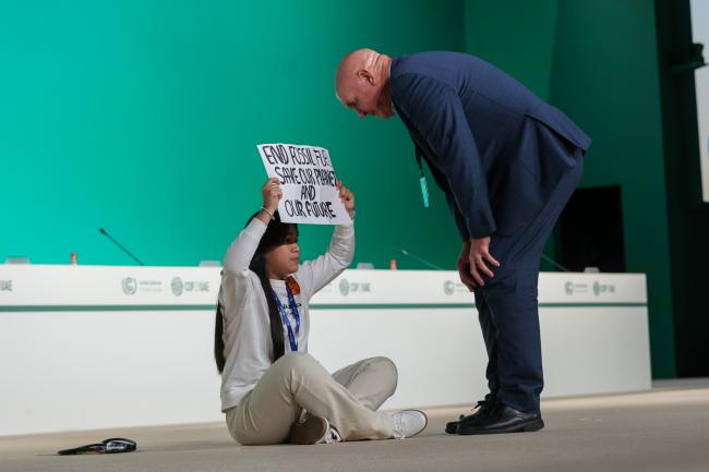 An environmental activist interrupted a high-level event and was excorted out by UN Security