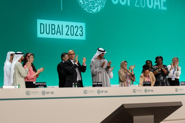 Presidency and Secretariat celebrating the adoption of the Global Stocktake