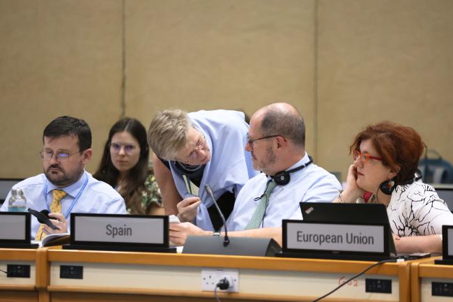 Delegates from the EU consult informally  - OEWG2 SPP - 12Dec23 - Photo