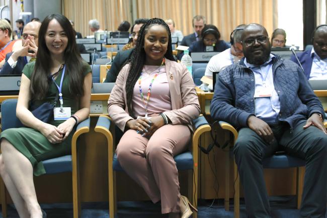 Tellers pose for a group photo L-R Itsuki Kuroda, Japan, Keima Gardiner, Trinidad and Tobago, and Mpho Mauffat Tshitangoni, South Africa 