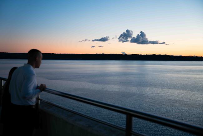 staff looking out over the sunset at the venue