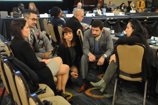 Delegates from the Latin America region in discussions before the session