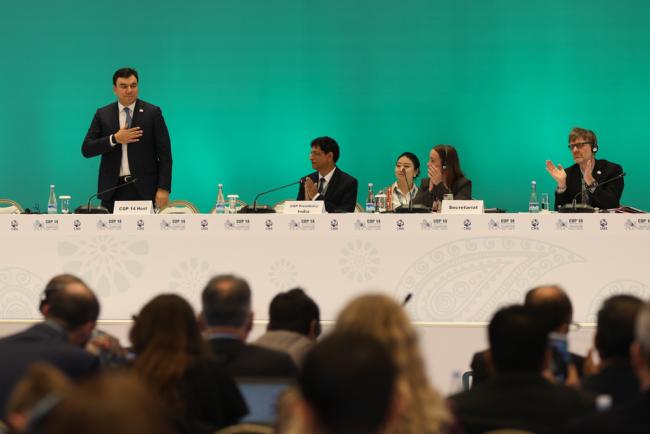 Aziz Abduhakimov, Uzbekistan, is welcomed in as the CMS COP14 Chair