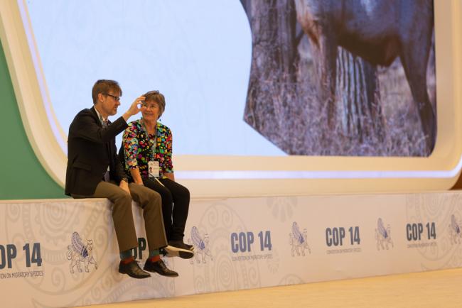 Melanie Virtue, Convention on Migratory Species (CMS), speaks with a colleague
