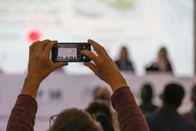 Delegate takes photo