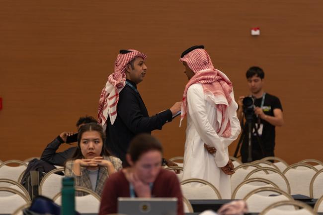 Delegates from Saudi Arabi speak informally