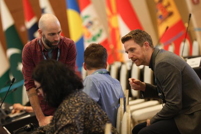Delegates speak informally