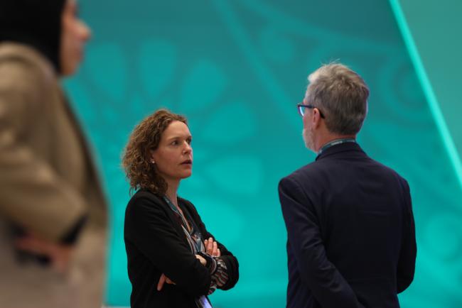 Hilde Eggermont, EU, speaks with a delegate