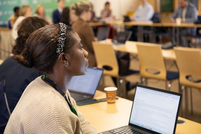 A participant follows the proceedings