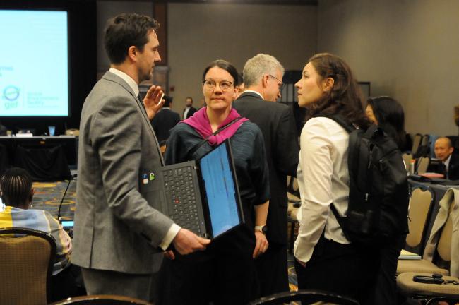 Participants confer