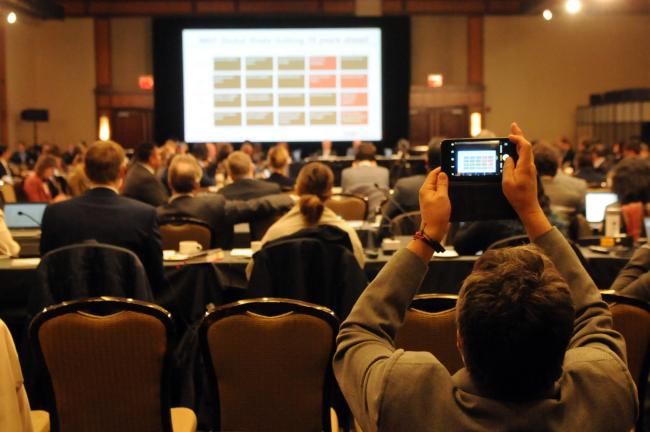 A participant takes a photo of the slide on WEF Global Risks
