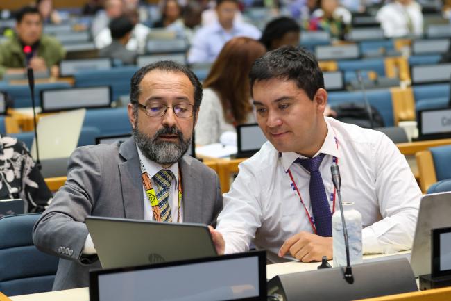 Delegates from Chile conferring